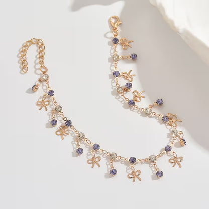 Cheville Bohème Dorée – Nœud Bleu et Pompon Franges