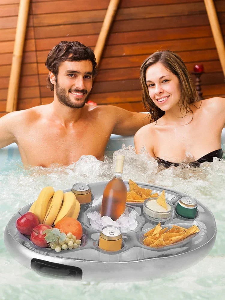 Couple enjoying drinks and snacks with an Inflatable Pool Float Cup Holder & Drink Tray in a hot tub.